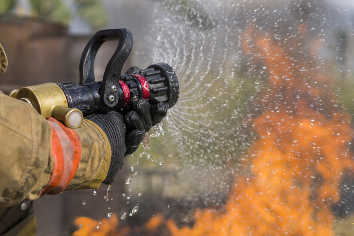 Firefighters Extinguishing House Fire